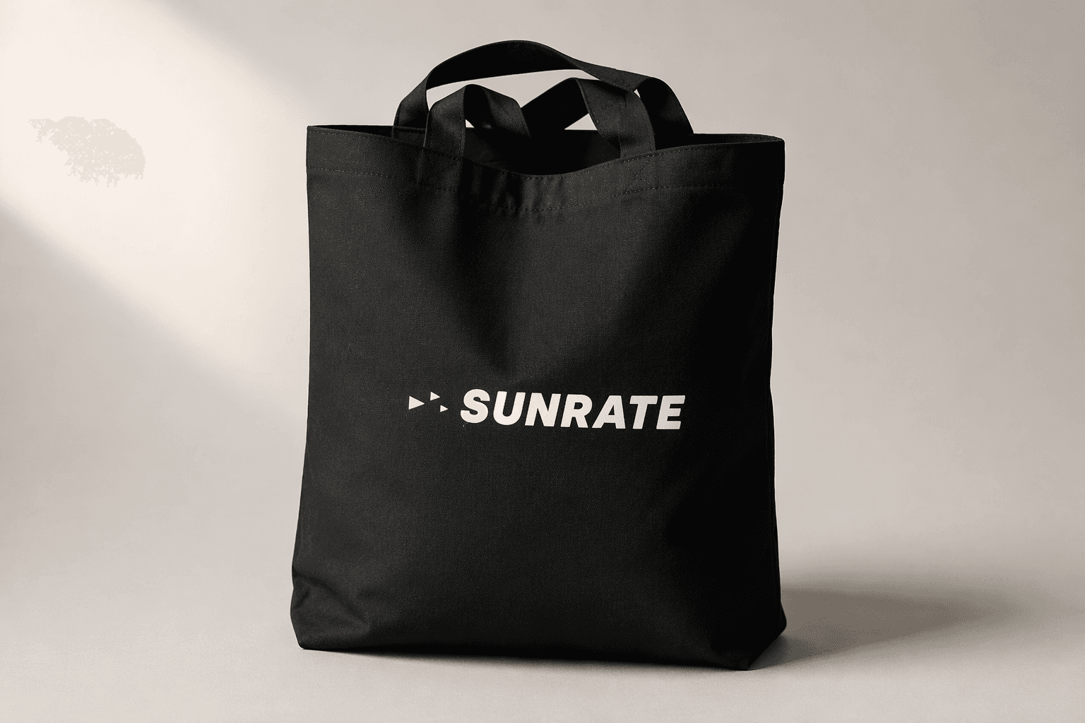 Sunrate — Branded tote bags and mugs for a fintech team, sourced and printed to their brand palette.
